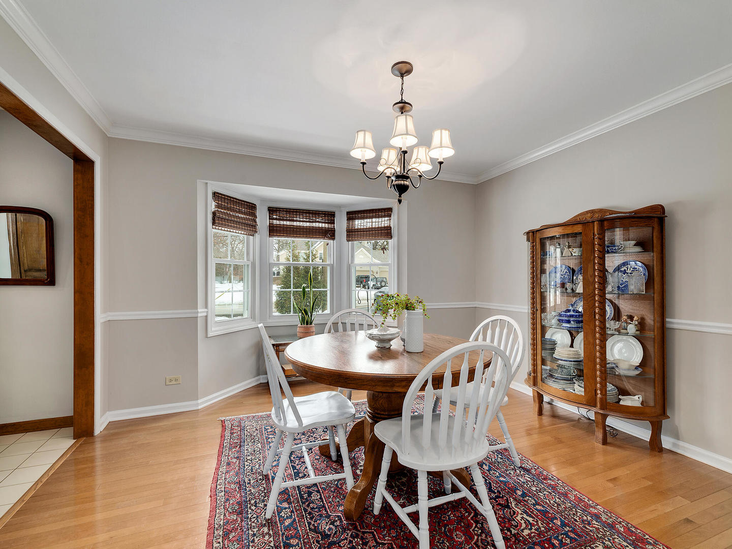 27W626 Garys Mill Road Winfield, IL 60190 - Photo 4 of 23 a view of a dining room with furniture wooden floor and chandelier
