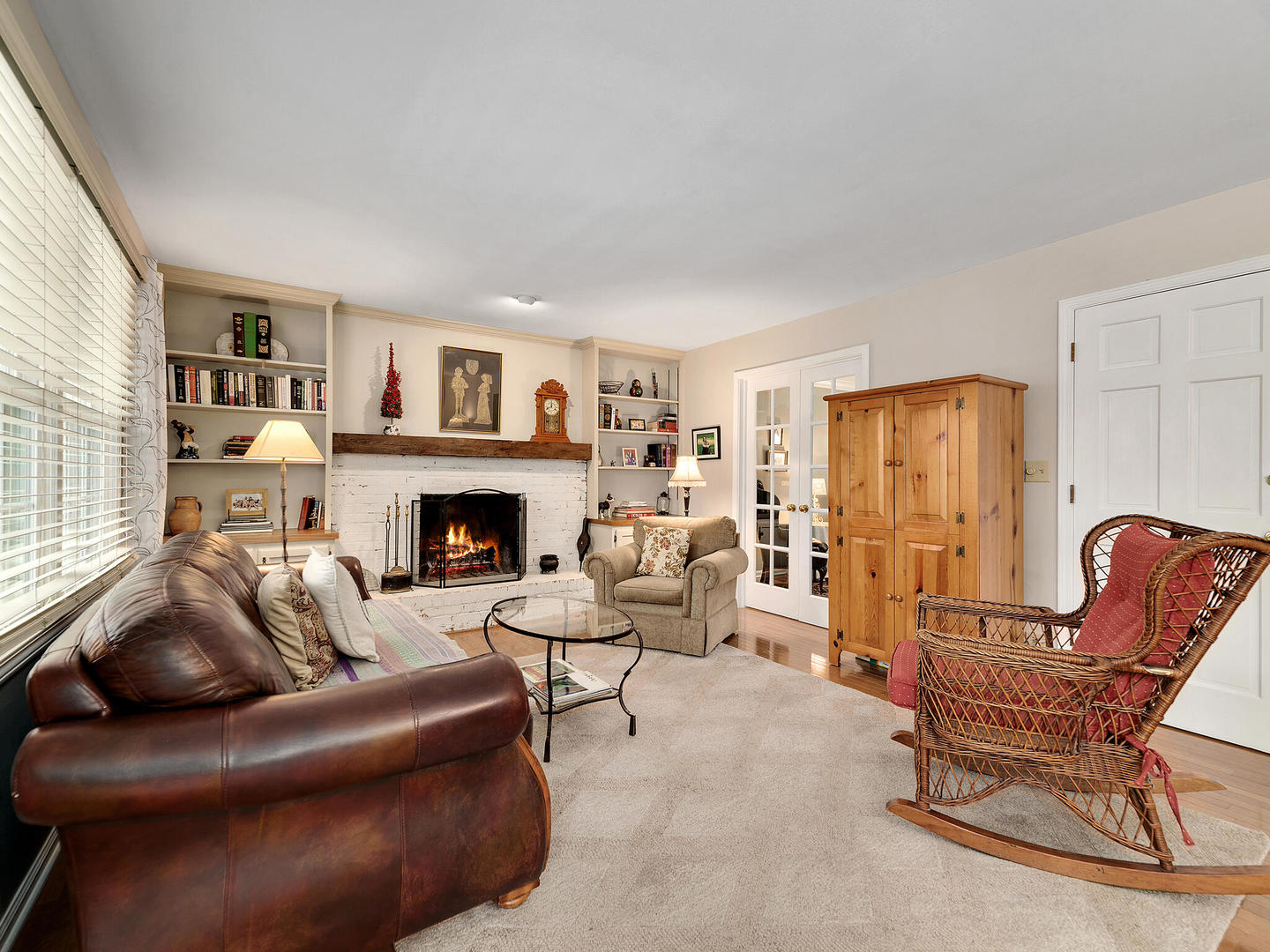 27W626 Garys Mill Road Winfield, IL 60190 - Photo 6 of 23 a living room with furniture and a fireplace