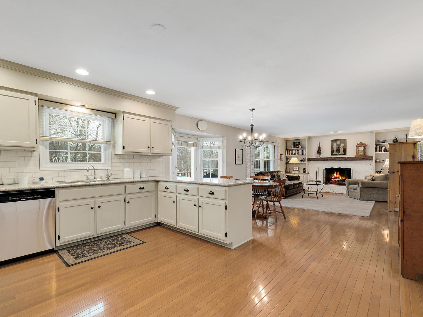 27W626 Garys Mill Road Winfield, IL 60190 - Photo 8 of 23 a large white kitchen with lots of counter space and windows