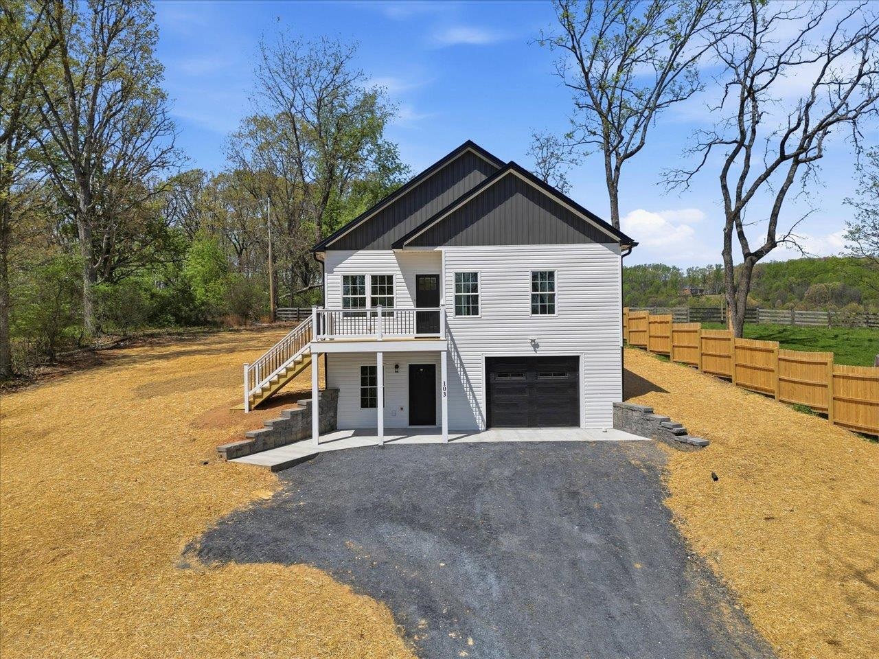 103 Hilltop Terrace Road Staunton, VA 24401 - Photo 41 of 47 a front view of a house with a yard and garage