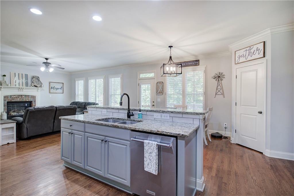 12 Autumn Wood Drive Cartersville, GA 30120 - Photo 13 of 48 a kitchen with granite countertop a stove a sink and a refrigerator