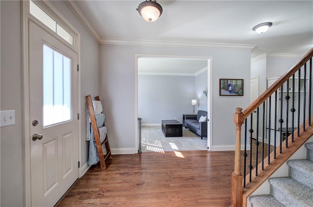 12 Autumn Wood Drive Cartersville, GA 30120 - Photo 17 of 48 a view of entryway and livingroom with furniture and wooden floor
