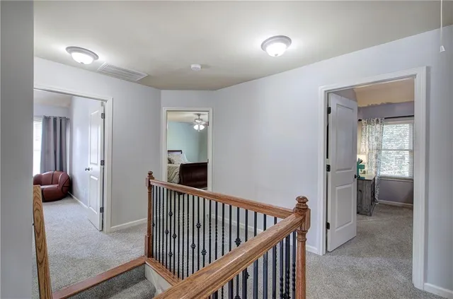 a view of a hallway to a livingroom and a couch