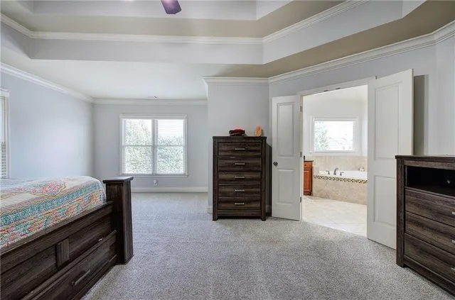 a bedroom with a bed and furniture