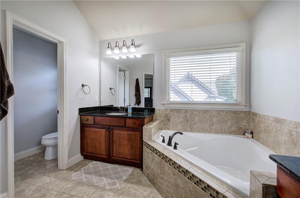12 Autumn Wood Drive Cartersville, GA 30120 - Photo 24 of 48 a bathroom with a bathtub and a sink