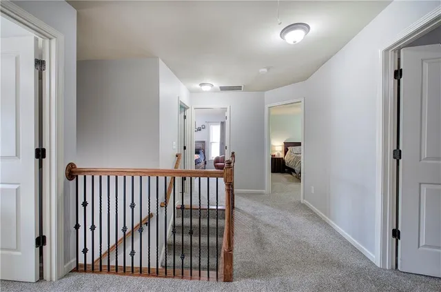 a view of a hallway with closet and entryway