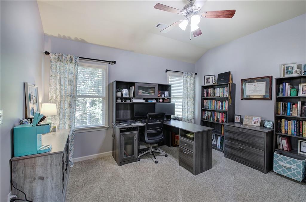 12 Autumn Wood Drive Cartersville, GA 30120 - Photo 27 of 48 a view of a workspace with furniture and a window