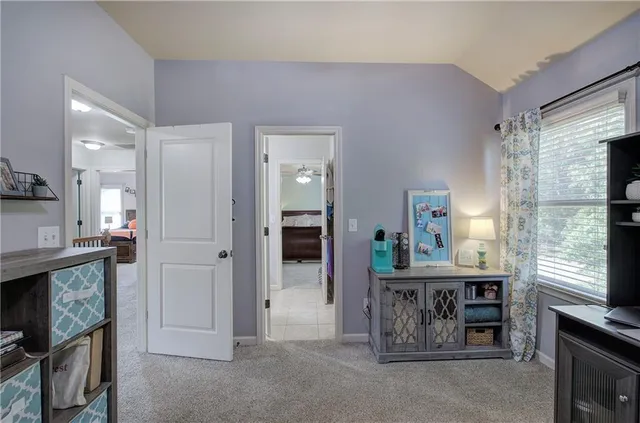 a kitchen with stainless steel appliances kitchen island granite countertop a refrigerator and a stove