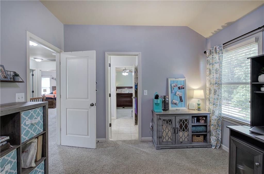 12 Autumn Wood Drive Cartersville, GA 30120 - Photo 28 of 48 a kitchen with stainless steel appliances kitchen island granite countertop a refrigerator and a stove