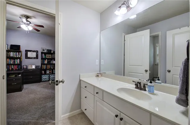 a spacious bathroom with a double vanity sink and a mirror