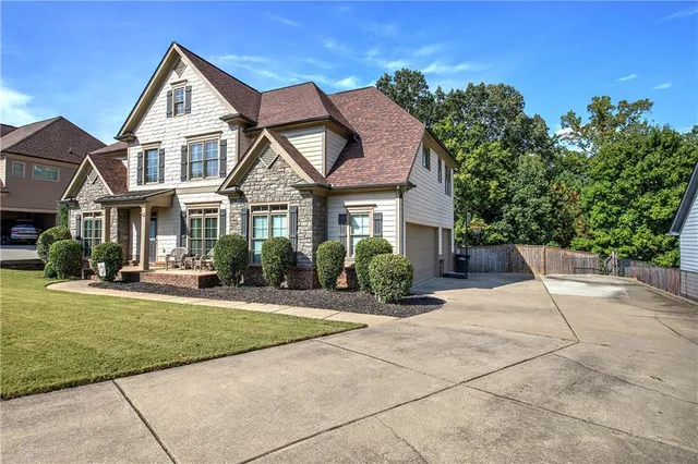 a front view of a house with a yard