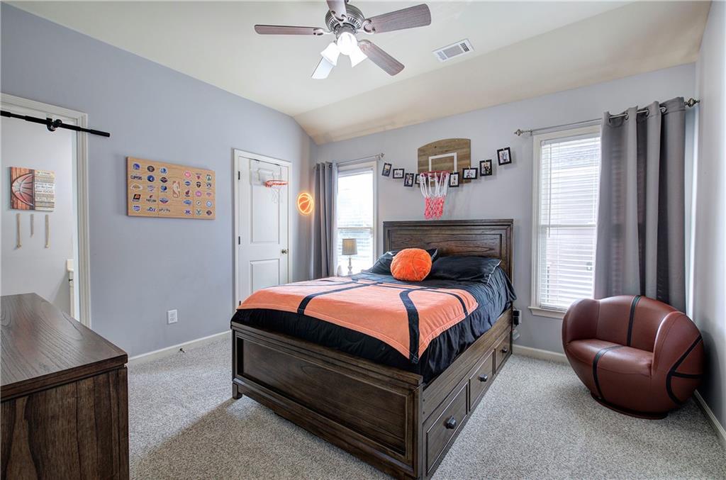 12 Autumn Wood Drive Cartersville, GA 30120 - Photo 33 of 48 a bed room with a bed and a couch