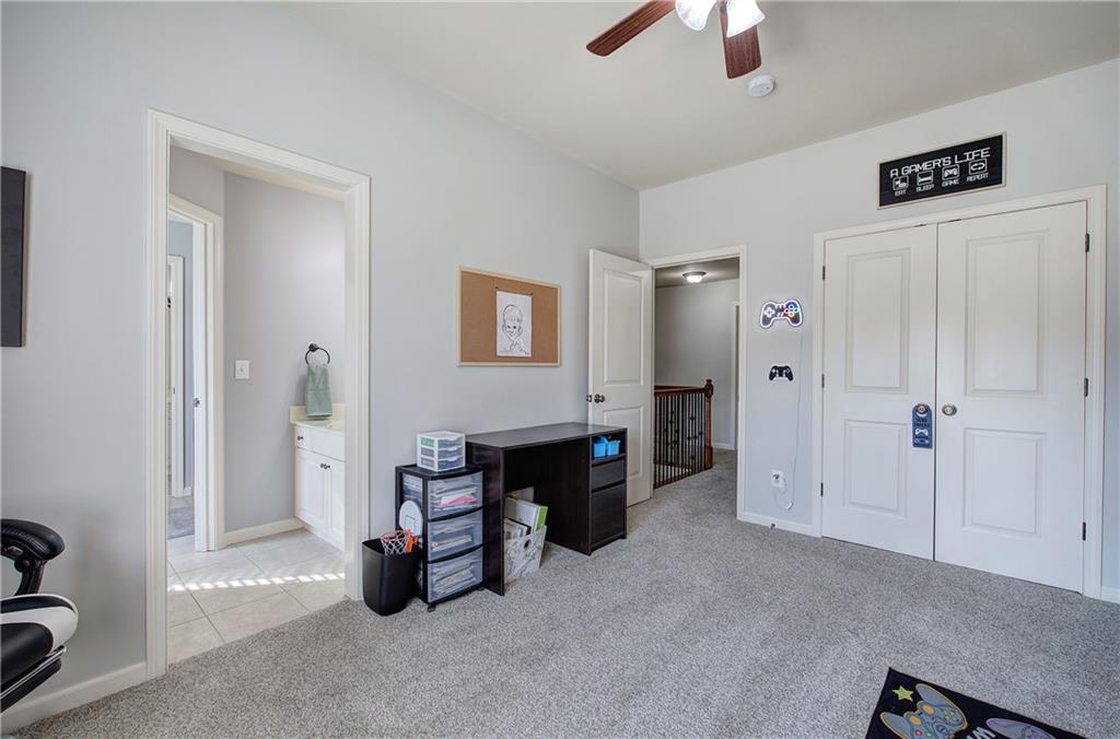 12 Autumn Wood Drive Cartersville, GA 30120 - Photo 36 of 48 a living room with furniture and a chandelier