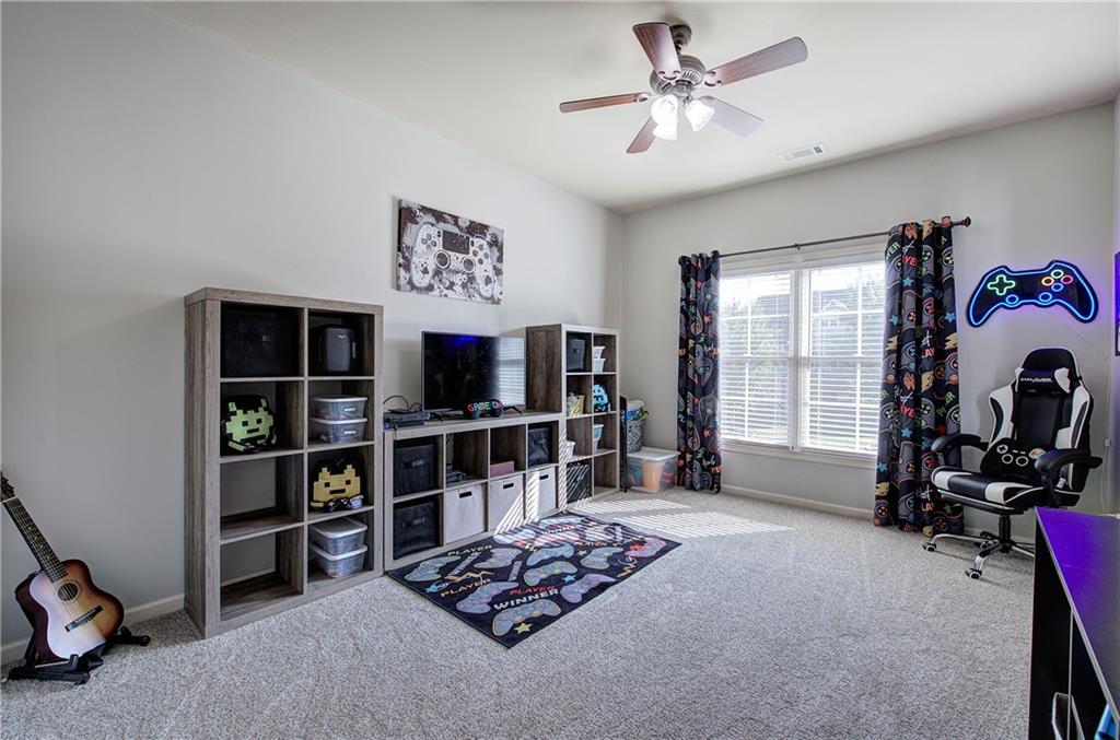 12 Autumn Wood Drive Cartersville, GA 30120 - Photo 37 of 48 a living room with furniture a window and a flat screen tv