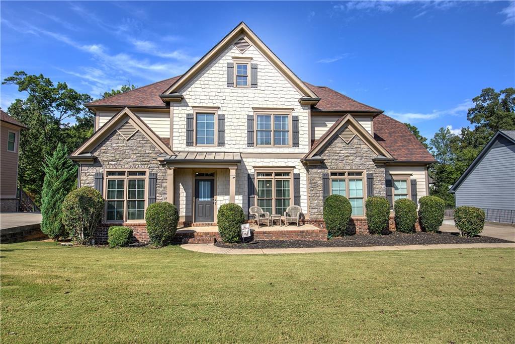 12 Autumn Wood Drive Cartersville, GA 30120 - Photo 4 of 48 a front view of a house with a yard