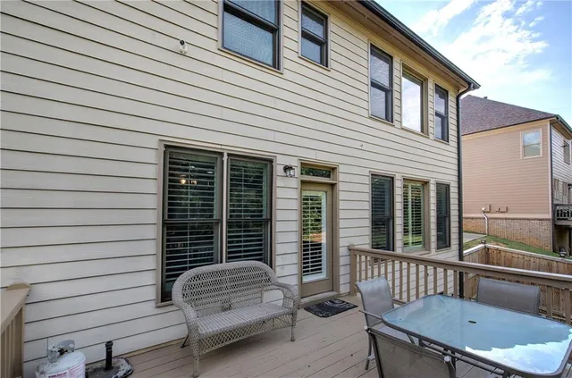 a view of a chair and table in the balcony