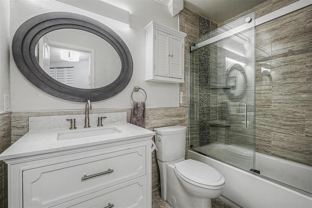1550 South Belcher Road, Unit 525 Clearwater, FL 33764 - Photo 20 of 28 a bathroom with a sink a toilet and a mirror