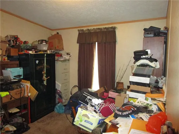 walk in closet with clothes and shoes