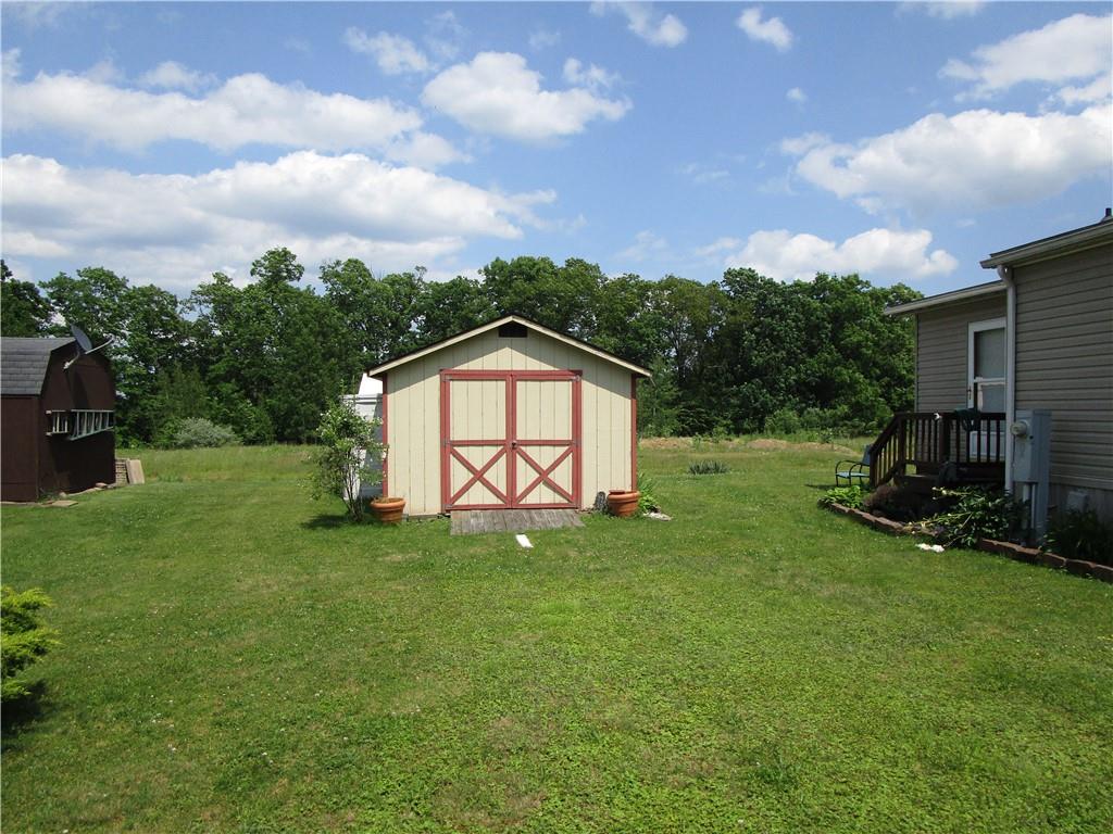 615 Amy Lane Butler, PA 16001 - Photo 4 of 13 a view of a backyard with a garden and entertaining space