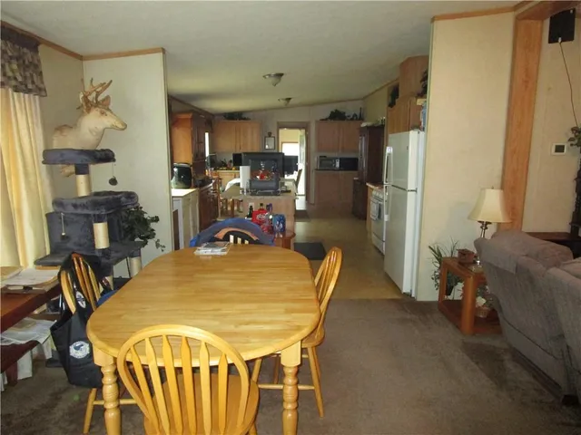 a dining room with furniture and a chandelier