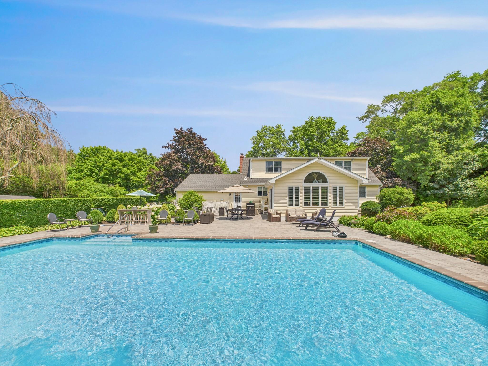 Outdoor pool with outdoor dining area and a patio area