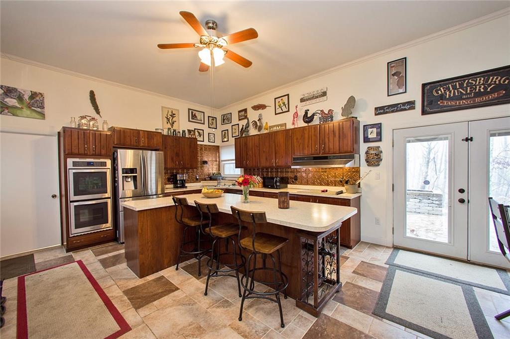 584 Elliotsville Road Farmington, PA 15437 - Photo 7 of 25 With plenty of space to eat in the kitchen!! Nice built in wine rack.