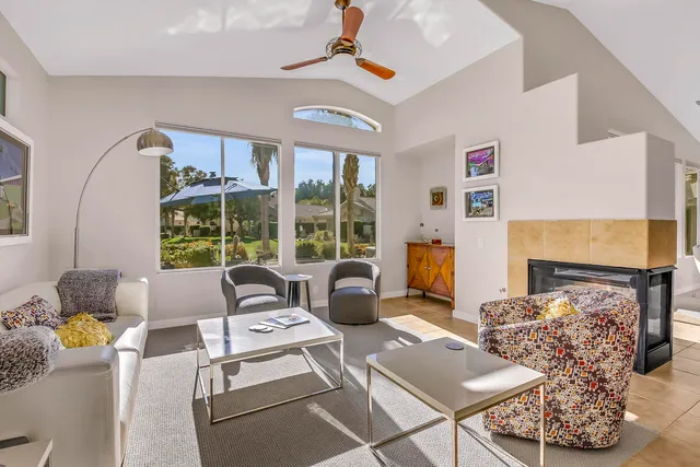 a living room with furniture and a rug
