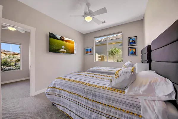 a view of a workspace with furniture and window