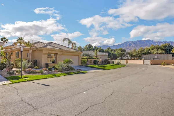 a view of a backyard with sitting area