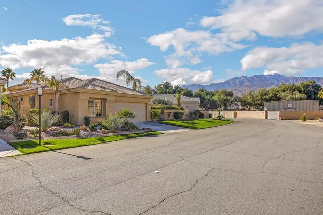 a view of a backyard with sitting area