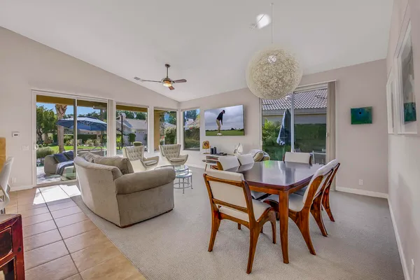 a dining room with furniture and window