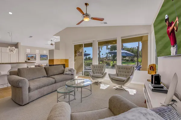 a living room with furniture and a large window