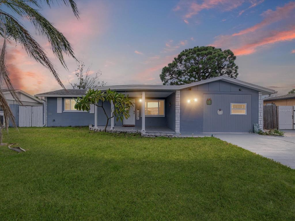 3344 Chauncy Road Holiday, FL 34691 - Photo 1 of 1 a view of a house with a backyard