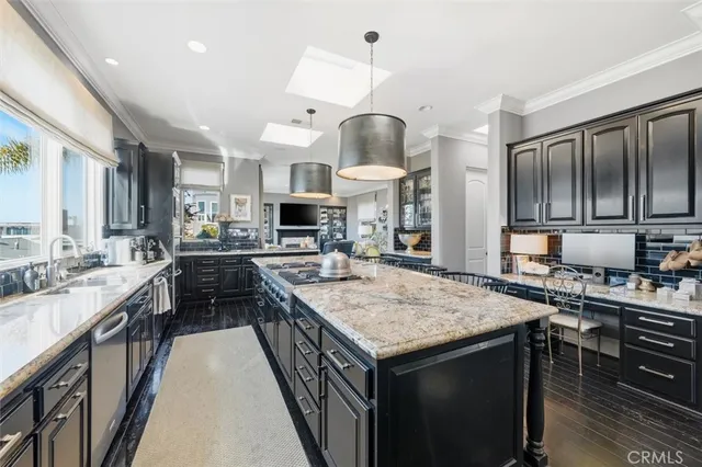 a kitchen with stainless steel appliances a stove sink and cabinets