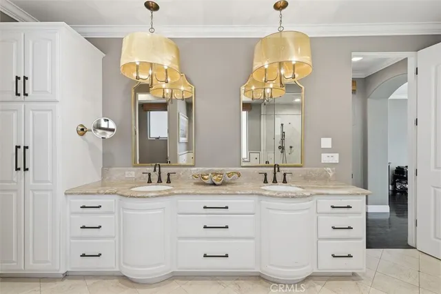 a bathroom with a double vanity sink mirror and