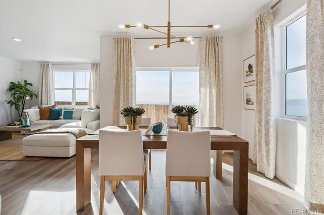 a view of a dining room with furniture and window