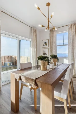 a kitchen with a table and chairs