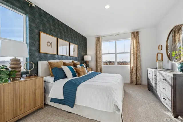 a bedroom with bed and window