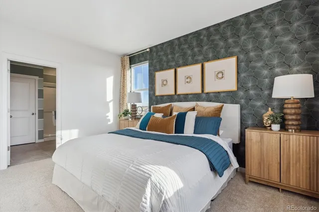 a bedroom with a bed and a lamp