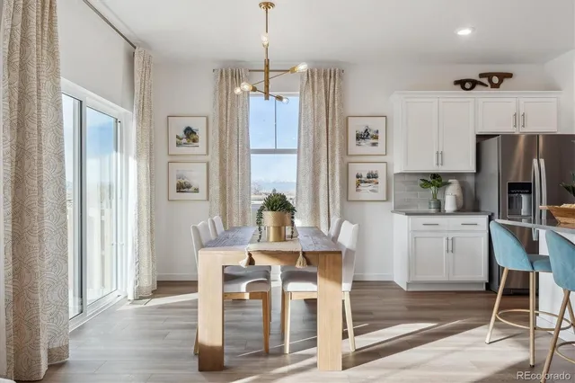 a kitchen with stainless steel appliances granite countertop a refrigerator and microwave