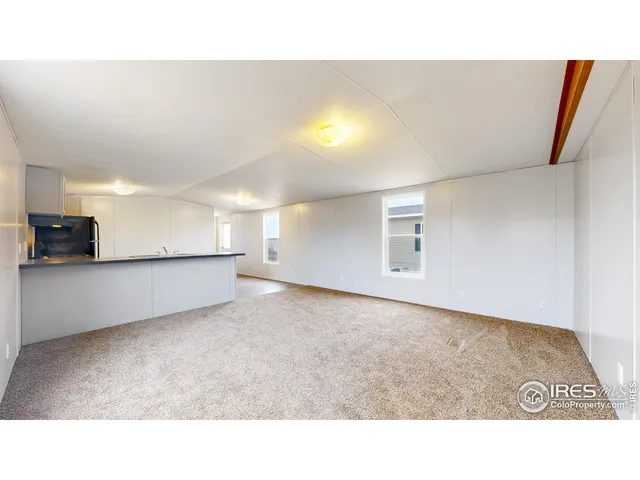 a open kitchen with sink and cabinets