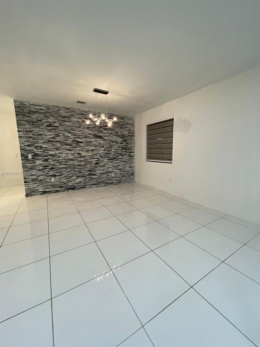 4451 Southwest 159th Path Miami, FL 33185 - Photo 7 of 24 a view of a ceiling fan and window