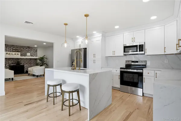 a kitchen with a table and chairs in it