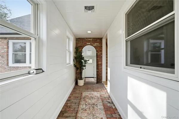 a view of a hallway with a window