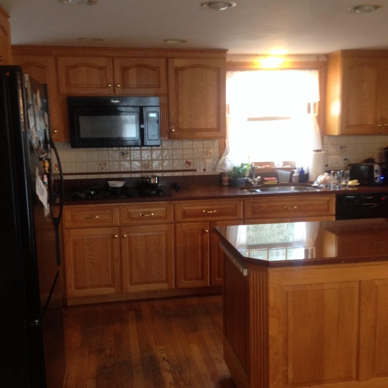 34 Cummings Road Newton, MA 02459 - Photo 3 of 8 a kitchen with granite countertop a sink and a stove top oven
