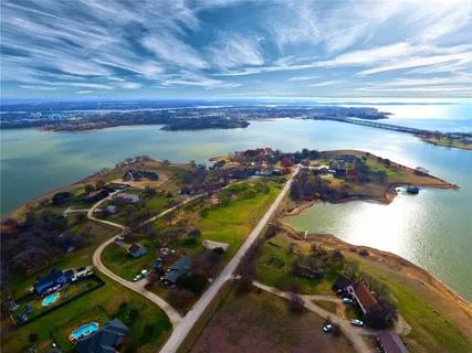 a view of a living room with furniture and floor to ceiling window