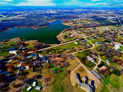 a view of balcony with couch and chairs