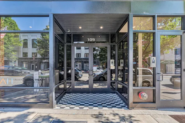 a view of an entryway with a door
