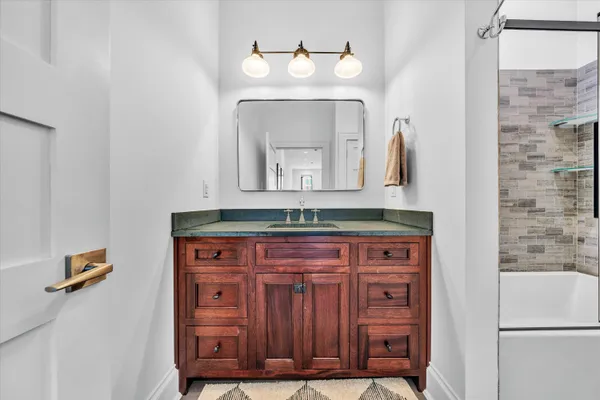 a white toilet sitting next to a bathroom sink
