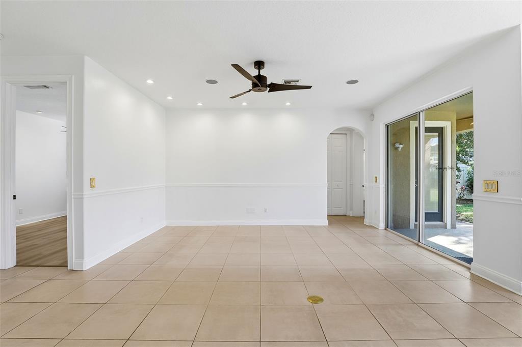 93 Braelock Drive Ocoee, FL 34761 - Photo 16 of 58 an empty room with entrance and windows